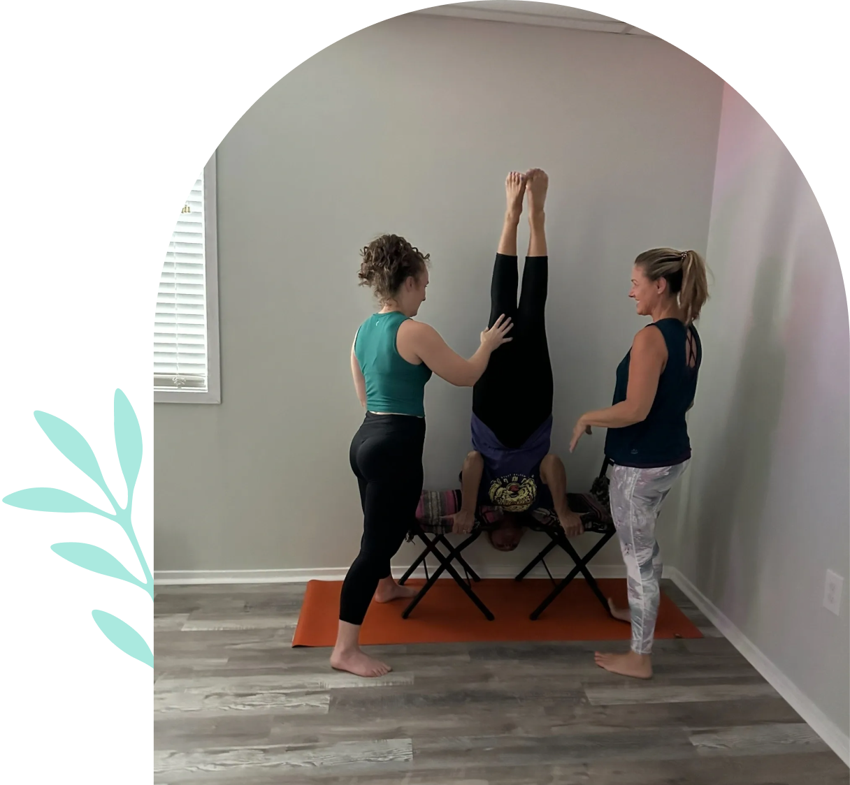 Group yoga session with headstand practice